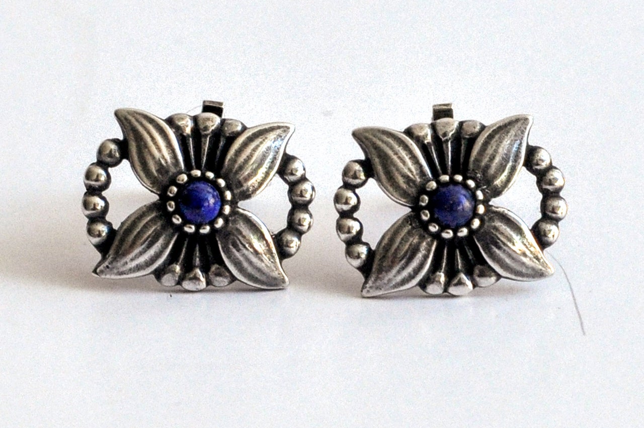 Stylized flower and bead clip earrings by Georg Jensen. Beautiful design and patina.