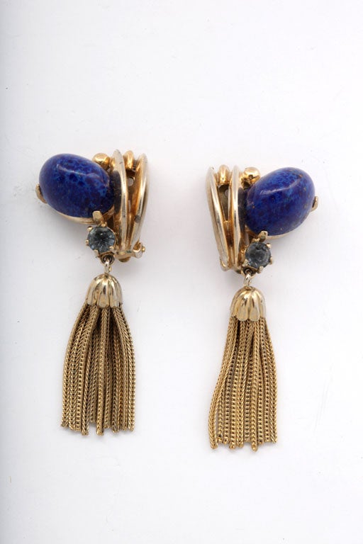 Schiaparelli goldtone tassel earrings with a lapis stone and a blue rhinestone.