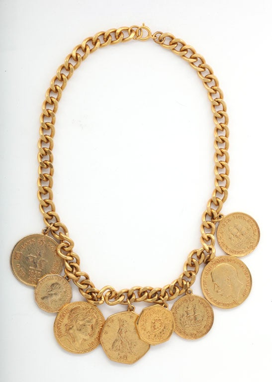 Fine quality eight goldtone coin necklace on a chain.