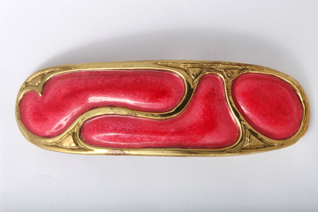 Stunning one of a kind brass buckle enameled in a raspberry pink tone.