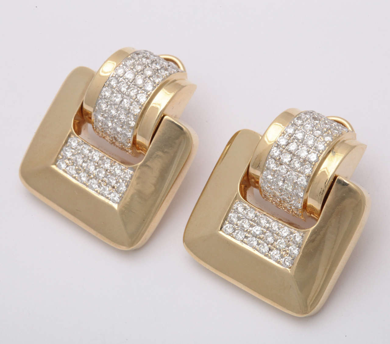 14kt Yellow Gold Omega Back Earrings with Posts.  Set with clean, full cut white Diamonds.  Earrings are moveable &  sway as you move.  Ca 1980.
Approximately 3 carats