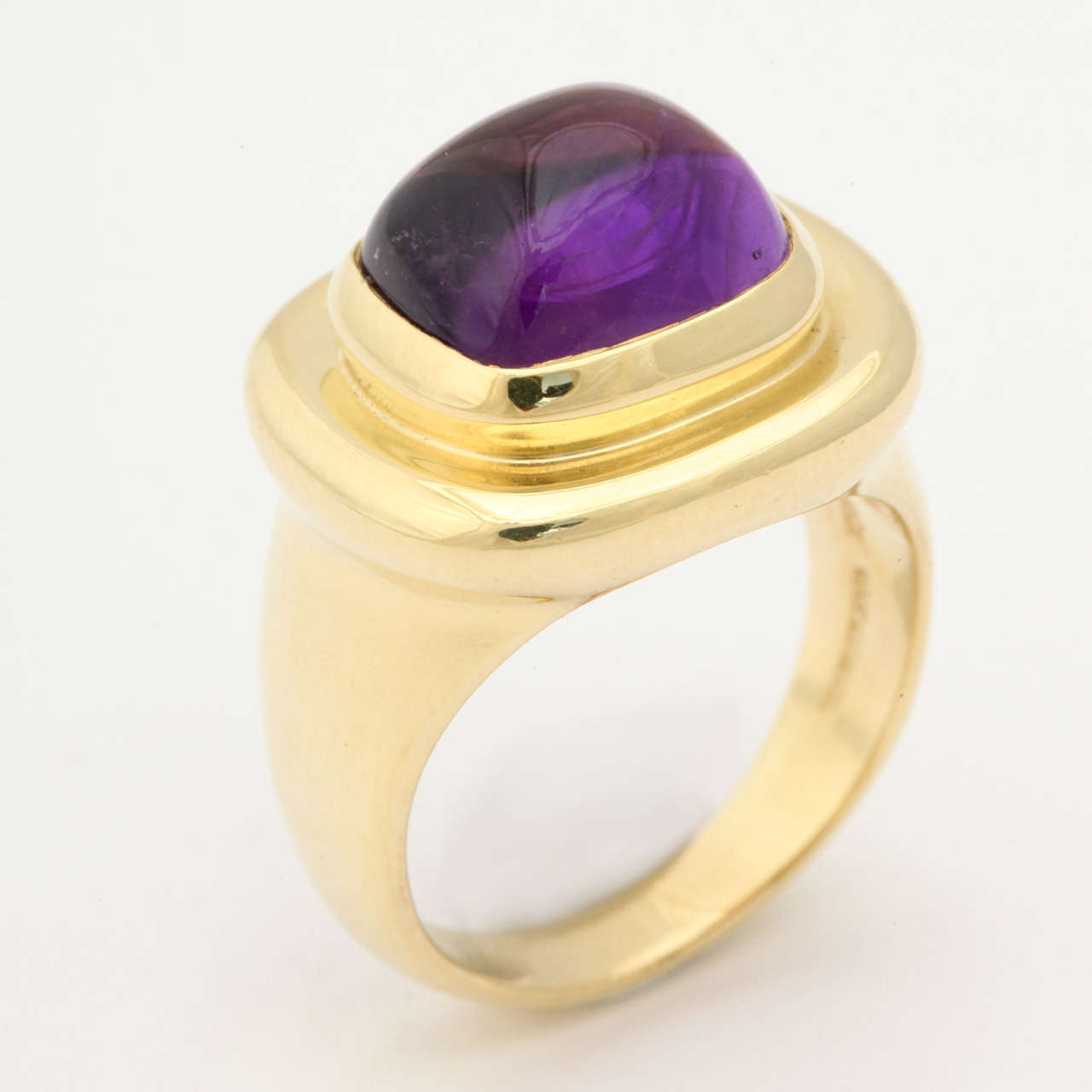 18 KT yellow Gold Chic Ring Consisting of 1 Bezel Set Cabochon High Quality Amethyst Weighing Approximately 5 Carats & Exhibiting a very deep gemstone quality color.

Made by Tiffany & Co.

Designed by Paloma Picasso in the 1980s.