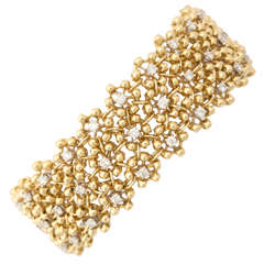 1980s Piranesi Flexible Diamond Gold Flower Motif Bracelet 1980s Piranesi Flexible Diamond Gold Flower Motif Bracelet