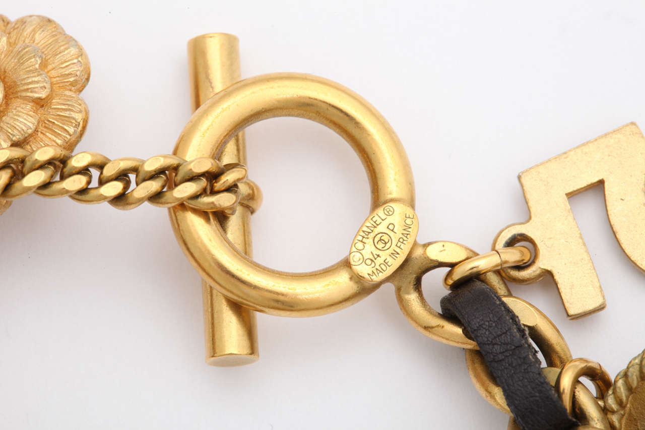 Vintage Chanel Iconic Charm Bracelet with Black Leather/Gold Chain In Fair Condition In Chicago, IL