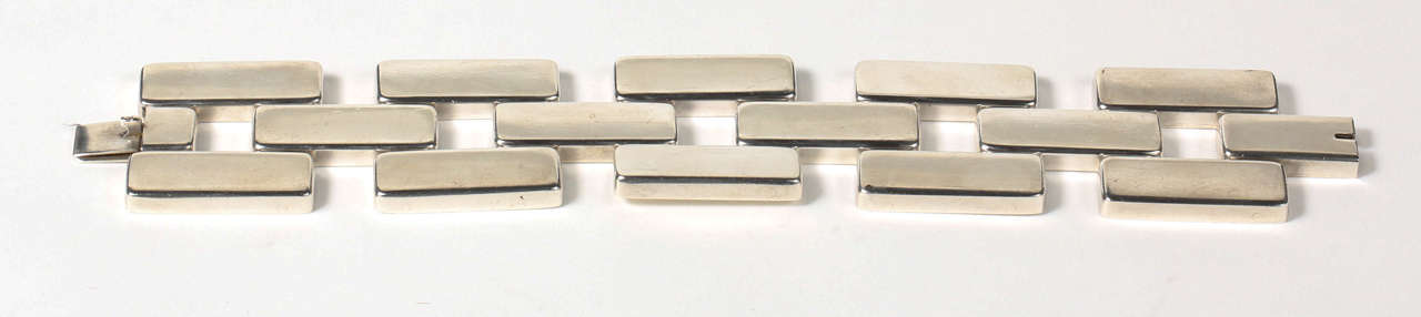 A stylish sterling silver bracelet of oversized articulated rectangular links, designed by Astrid Fog for Georg Jensen. Stamped on the back with the Georg Jensen logo, 