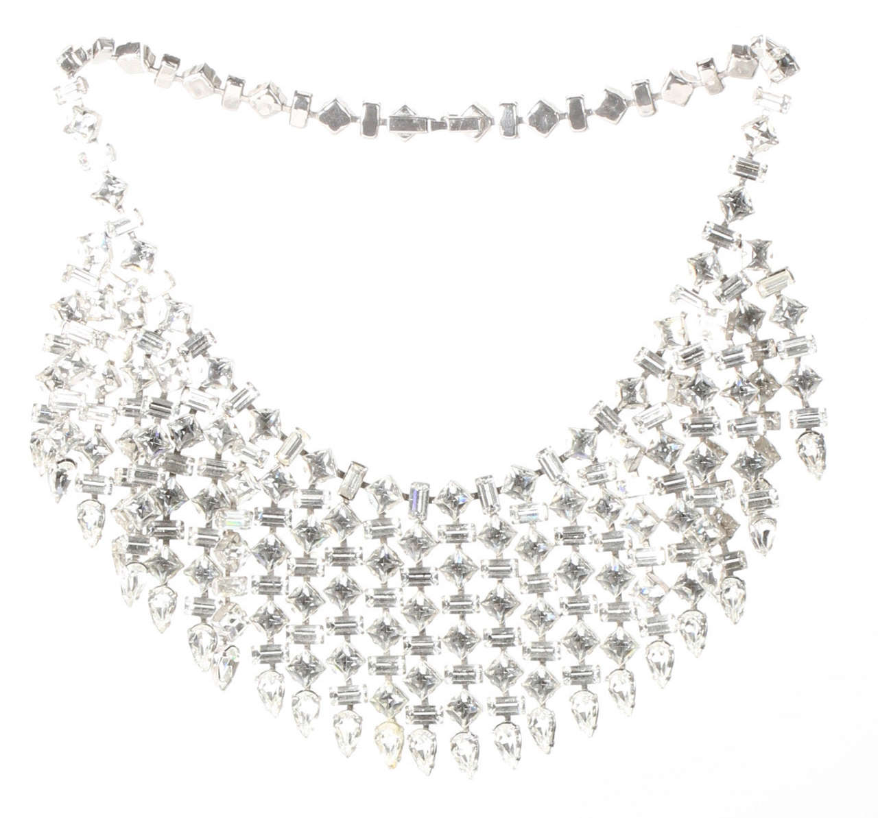 A glittering rhinestone collar with square, rectangular and teardrop stones. The length given below is for the necklace itself. The drop on the necklace is 2.25