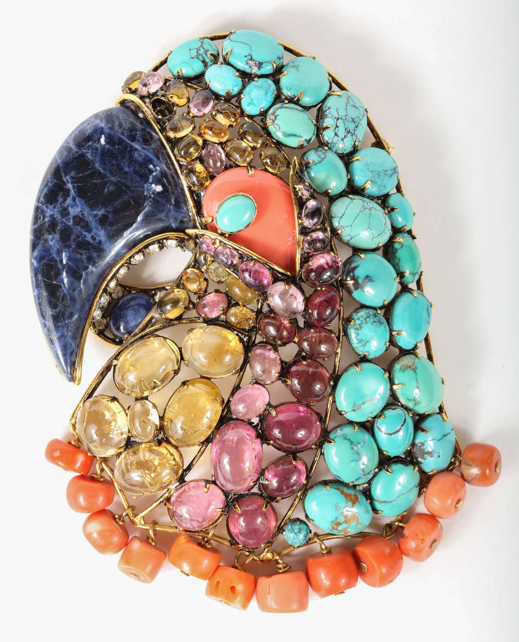 A dramatic and colorful large-scale parrot brooch by Iradj Moini of brass set with lapis lazuli, coral, citrine, amethyst, turquoise and rhinestones. Marked on the back with the Iradj Moini logo plaque (see Image 8)