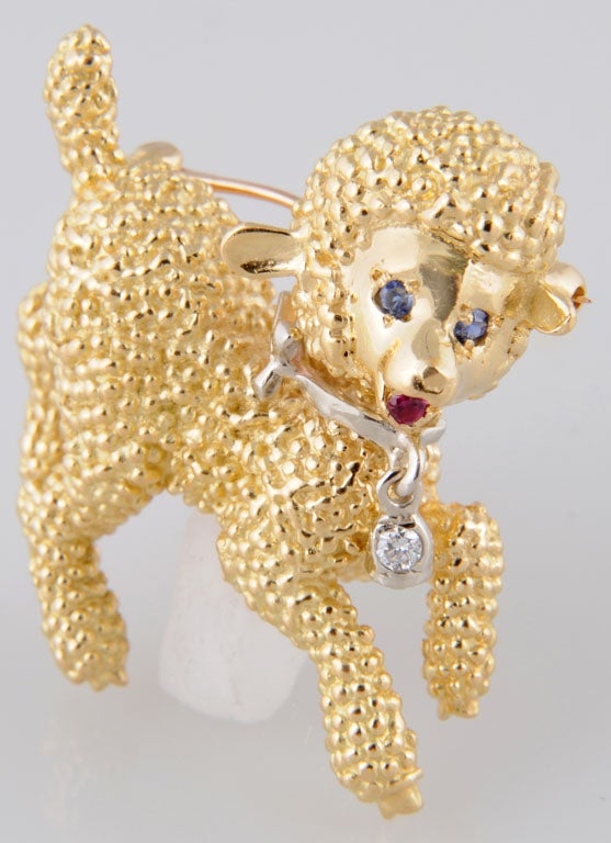 This adorable little guy has sapphire eyes, ruby tongue, and a diamond tag on his collar.  He has a a lovely 3D coat made of 18k yellow gold.