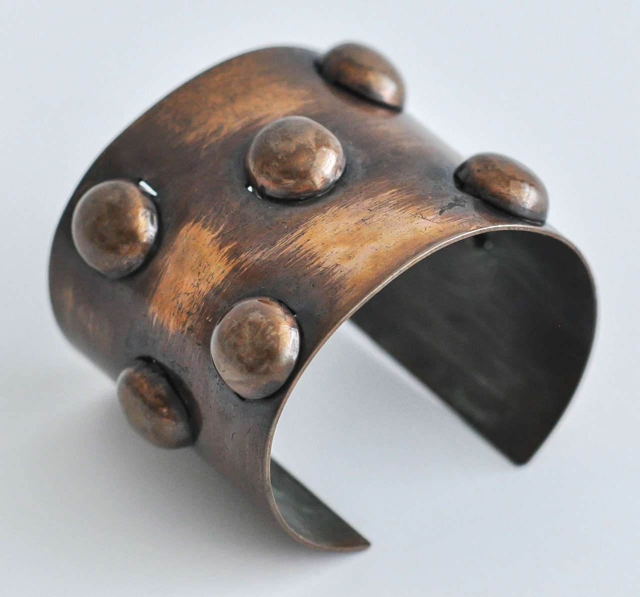 A rare, hand-assembled copper cuff by modernist craftsman Francisco Rebajes (1907-1990). The avant-garde, abstract geometric design of this bracelet suggests the 