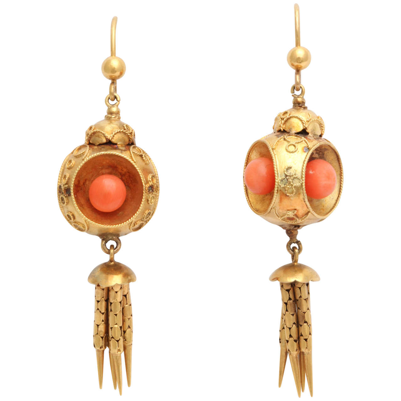 These gorgeous Victorian coral and gold earrings, circa 1870 are designed as 18k gold spheres with granulation suspending hi-karat gold tassels.

Victorian, circa 1870.

2 1/4 in. (5.7 cm) long.