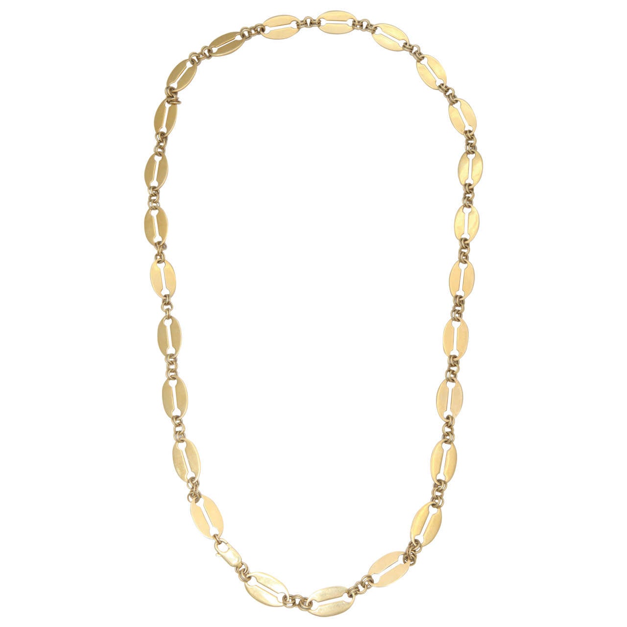 Inspired by Russian Orthodox chains of ancient Muscovy, this hand-finished chain comprises a line of twenty-five flat oval links of gilded silver, each with central horizontal opening and rounded ends, joined by double silver-gilded loops. Fitted