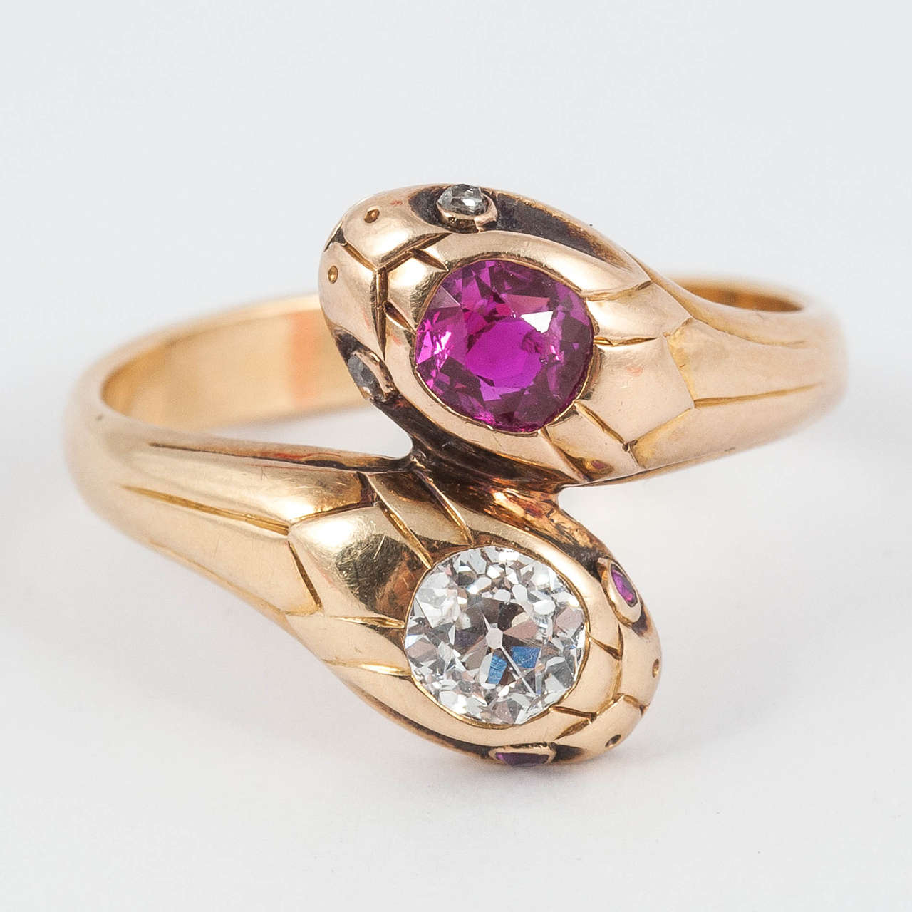 Stunning late Victorian double serpent Ring set with natural Ruby and Old Cut Diamond.

Ring size L 1/2