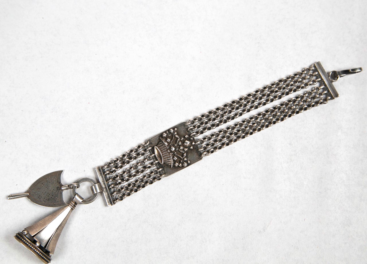 Handmade sterling silver bracelet with Dutch hallmarks and key.