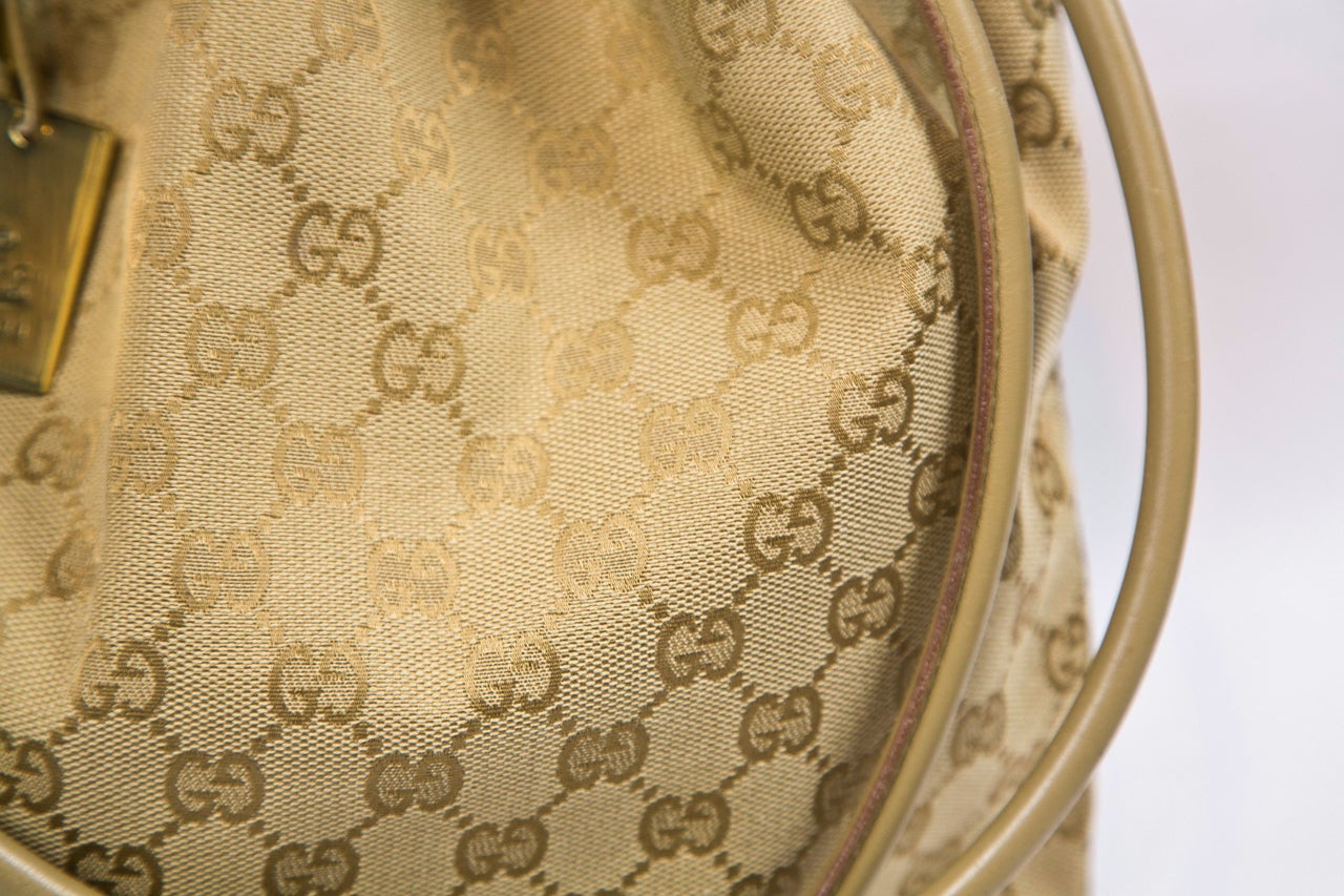 Brown Gucci canvas logo hobo bag