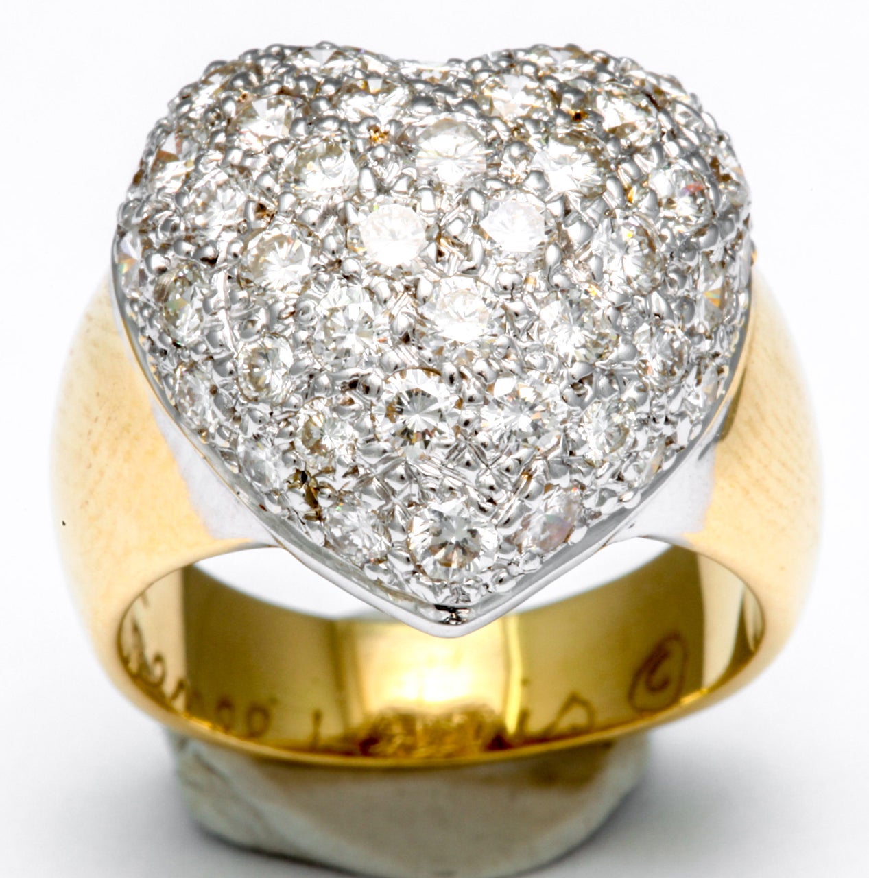 Lovely, heart ring featuring 48 diamonds weighing approximately 2.50 carats, crafted in 18k gold, signed Rene Lewis.