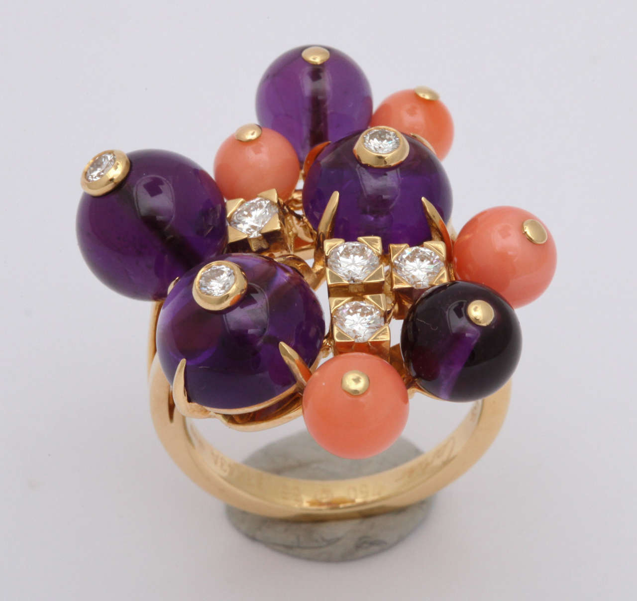 18KT Yellow gold ring set with Cabochon Amethyst stones and Coral round beads embellished with 7 full cut high quality diamonds signed Cartier Paris