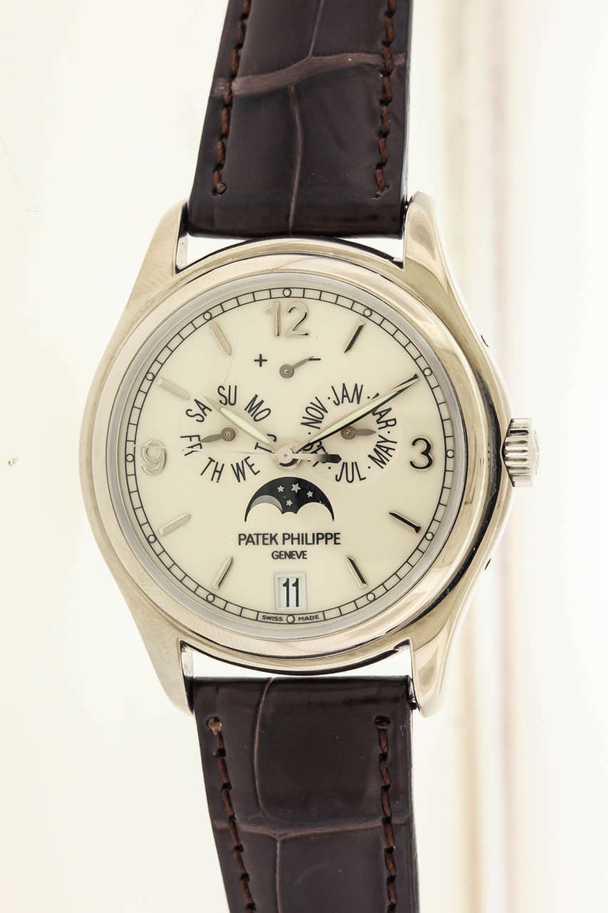 18K white gold Patek Philippe Ref. 5146G, circa 2005, is a moonphase calendar wristwatch, 39mm in diameter, with screwed-down transparent caseback, deployant buckle, and sapphire crystals. The off-white dial features applied white gold Arabic