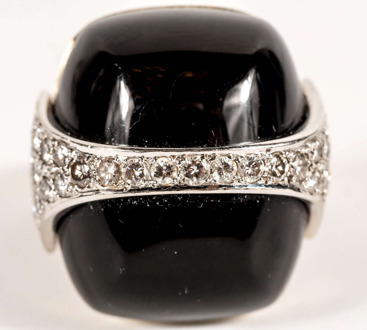 This ring is 18K yellow and white Gold Dome Ring by La Triomph, Set with 1.25 Carats of fine White Diamonds and Buff Cut Onyx . An extremely well made strong and bold geometric designed ring.This rings design is heavily influenced by the Art Deco