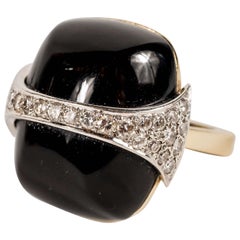 Strong and Bold 1970s La Triomphe Black Onyx Diamond Gold Ring