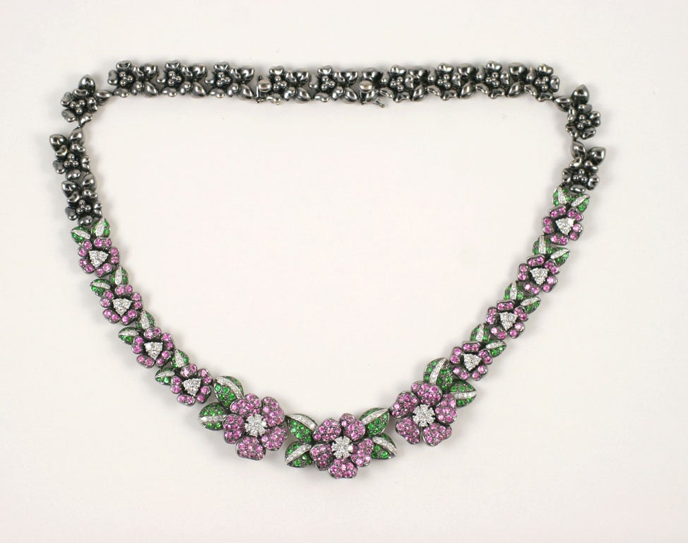 18 k Diamond floral necklace set in black gold with Pink sapphires Green Tsavorites, and diamonds