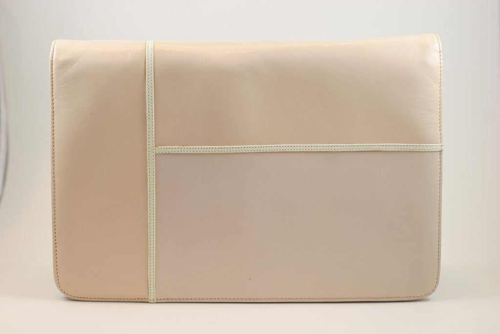 Never used, with the original Saks hang tag, Bruno Magli, Mondian inspired clutch/shoulder bag in pale lilac and pink. The shoulder strap is still wrapped in the original tissue paper. The bag measures approx. 10