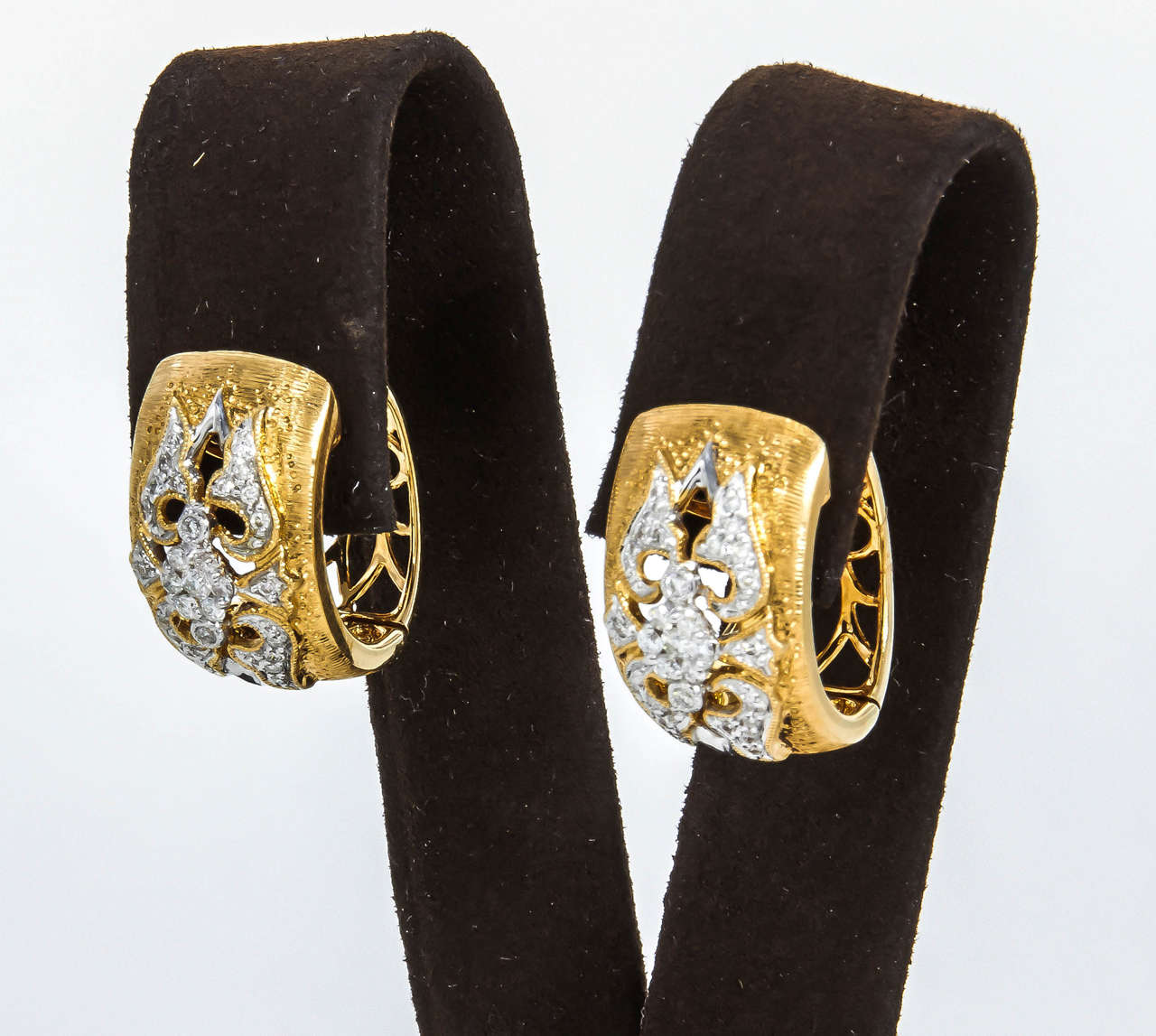 Inspired by the great Italian jewelry houses, this earring is one of a kind.

.55 carats of white diamonds set in 18k yellow and white gold. 
These earrings have exquisite detail and design. They are timeless.