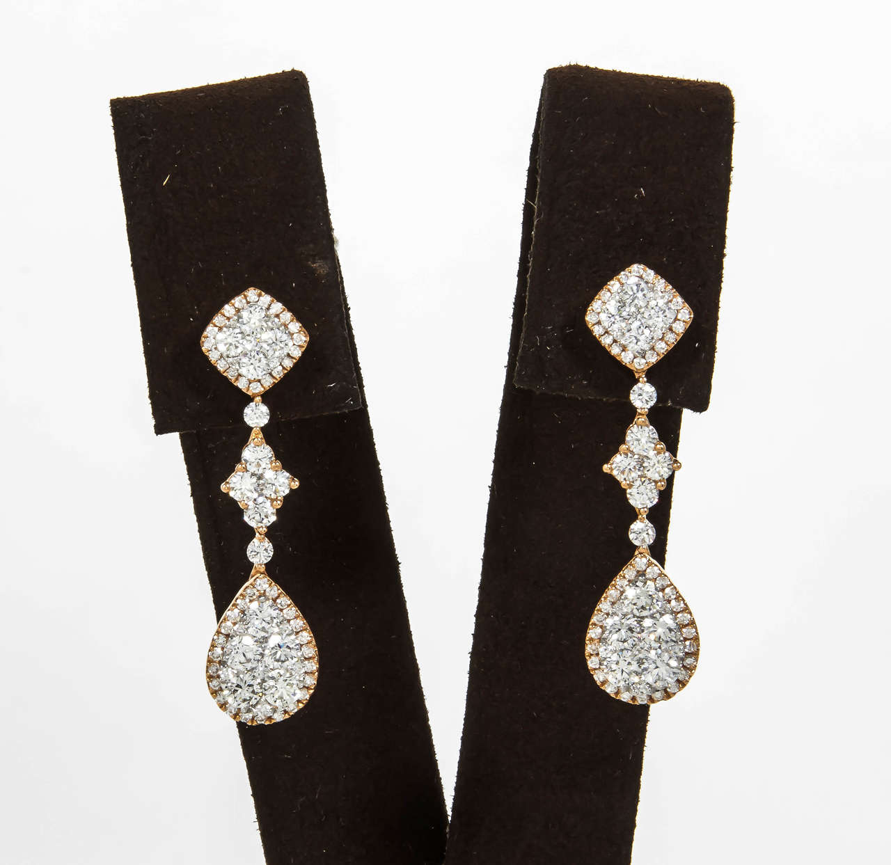 A stunning pair of earrings that can be worn for a lifetime. 

2.77 carats of round brilliant cut diamonds all F color VS clarity set in 18k Rose Gold. 

Approx 1.3 inches in length from post. The entire earring is over 1.5 inches long.