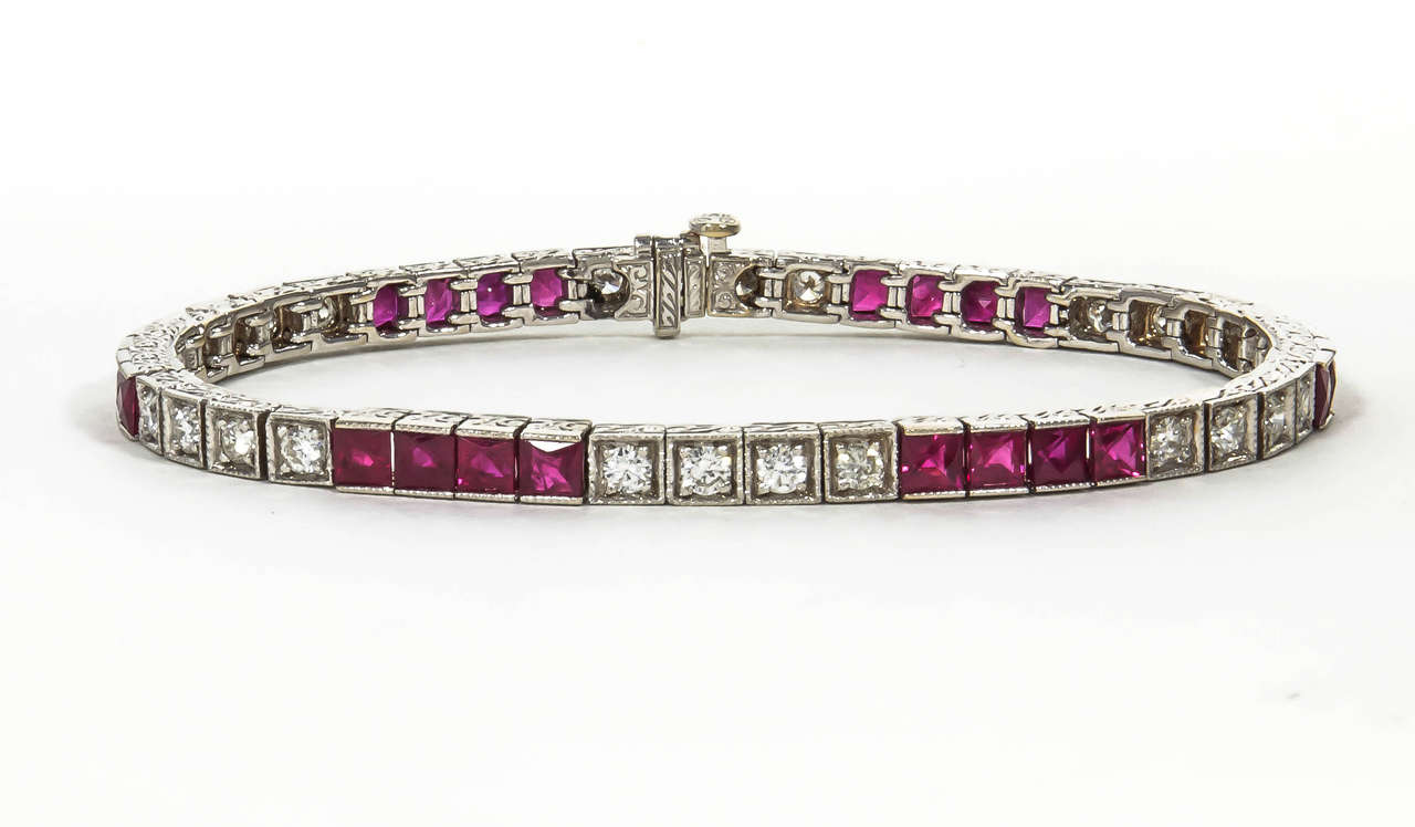 A classic bracelet with stunning engraved details. 

7.10 carat of fine Ruby
1.85 carats of round brilliant cut diamonds
18k white gold

7 inch length

Perfect to be worn everyday or for special occasions.