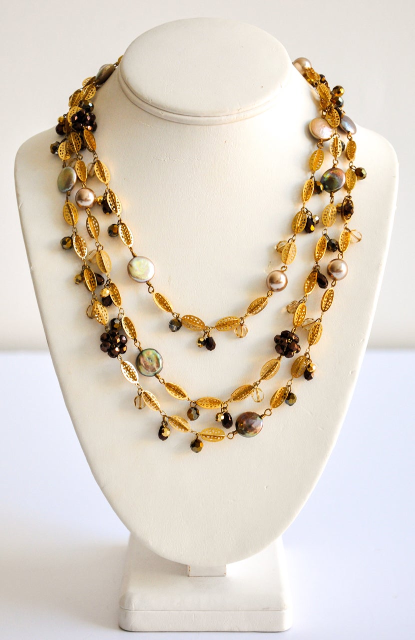 Multi-bead and pearl necklace by Miriam Haskell.  As is typical of Haskell's  best pieces she uses an interesting combination of materials.  A lovely, long necklace that can easily be doubled or tripled.  Flexible toggle fastener with hang tag.