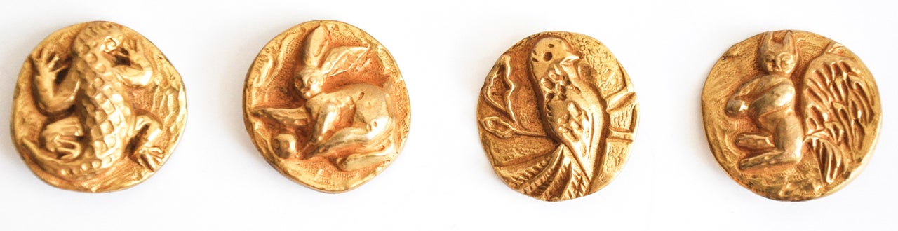 A rare set of Line Vautrin buttons depicting animals of the forest: alligator, rabbit, bird, and squirrel.  Incised initials 