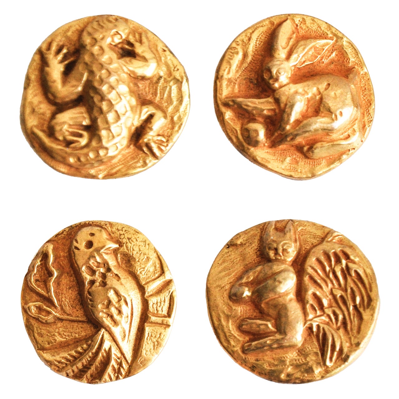 Set aus vier Vautrin-Knöpfen aus vergoldeter Bronze