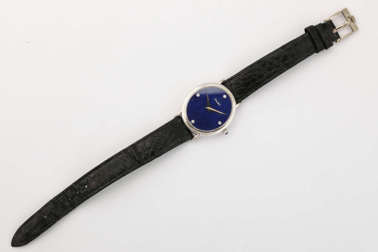 A rare ladies mechanical solid eighteen carat white gold watch.  The dial is made from a solid piece of lapis lazuli and set with brilliant cut diamonds at the 3,6,9 and 12 o'clock positions.  The watch comes on the original Piaget alligator band