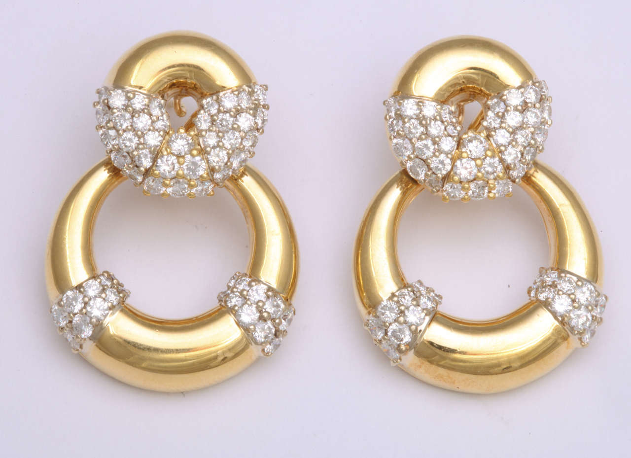 18k Yellow Gold earrings featuring 104 round diamonds weighing 4.42 carats.