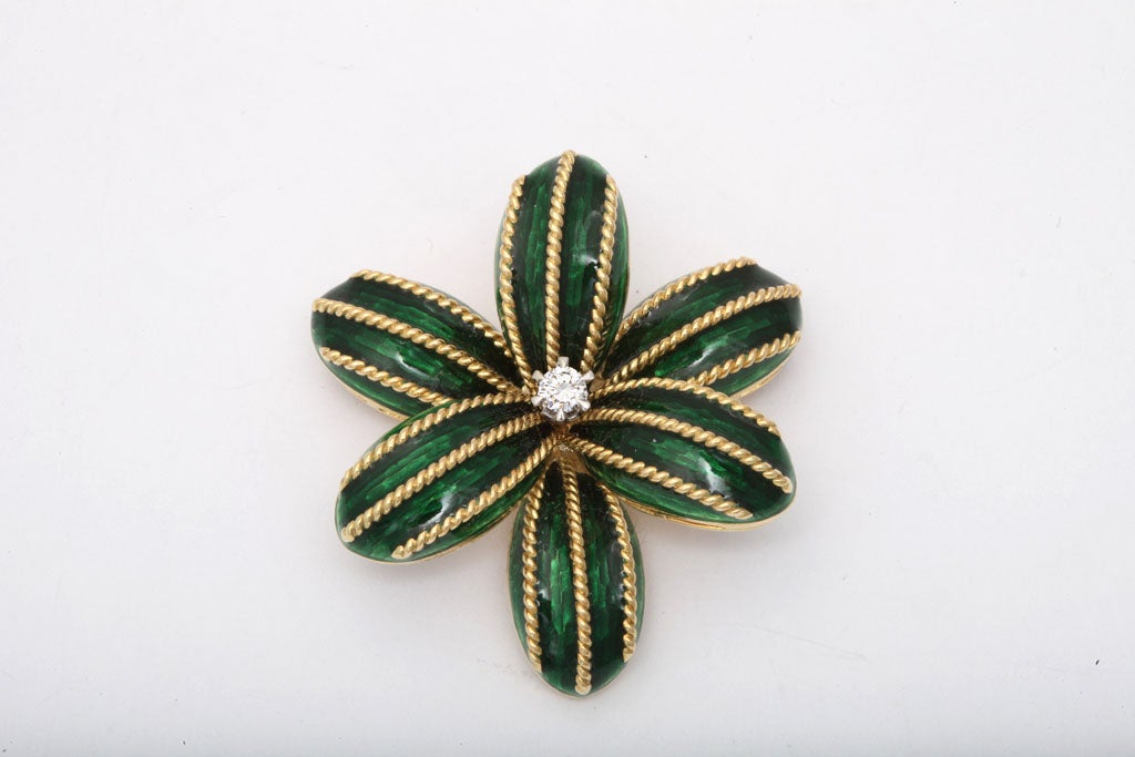 Cartier Pin with Bright Green Enamel & center Diamond made in the late 70's  Petals are highlighted by rope overlays. and the center Diamond is Prong set.