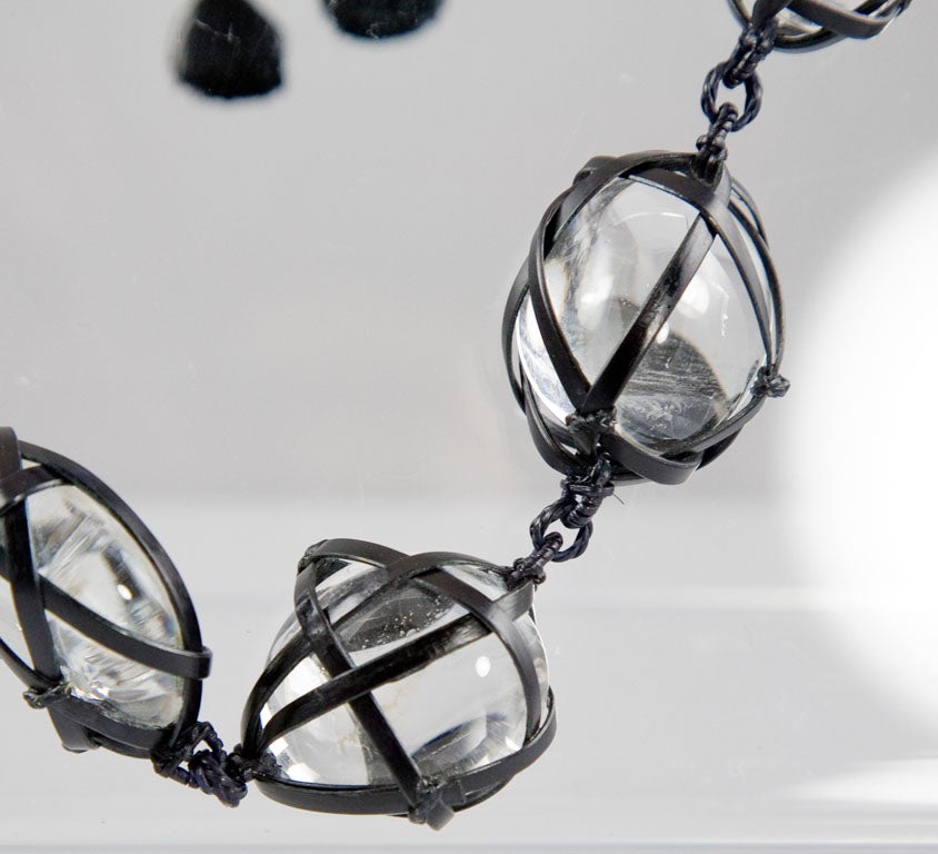 Twenty two unique pieces of rock crystal pebbles individually wrapped in bamboo and hanging from a silk cord.<br />
<br />
This is truly a definitive piece in the small output of jewelry made by Tina Chow capturing her ideals of beauty, perfection