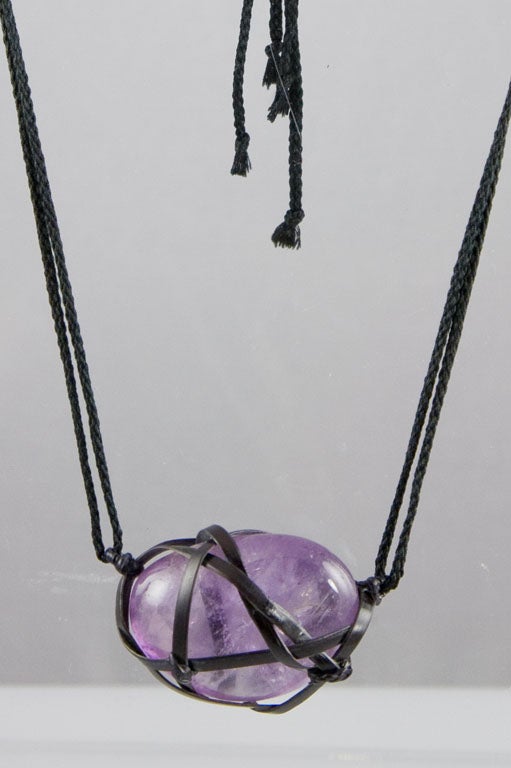 Tina Chow Oiso amethyst pendant.  Amethyst heart is wrapped in bamboo hanging from a double silk cord.