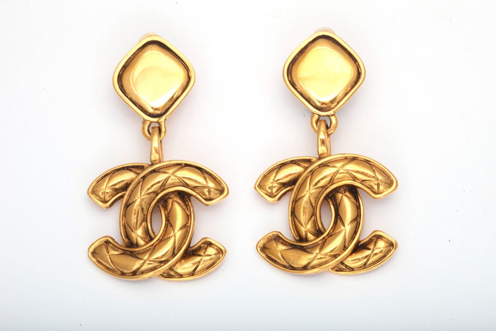 Chanel dangling earrings with quited CC motifs.