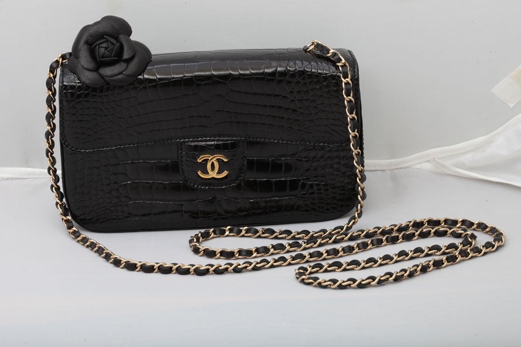 Beautiful Chanel mini croc bag with Camelia.
It comes with a box, serial sticker, authenticity card.
