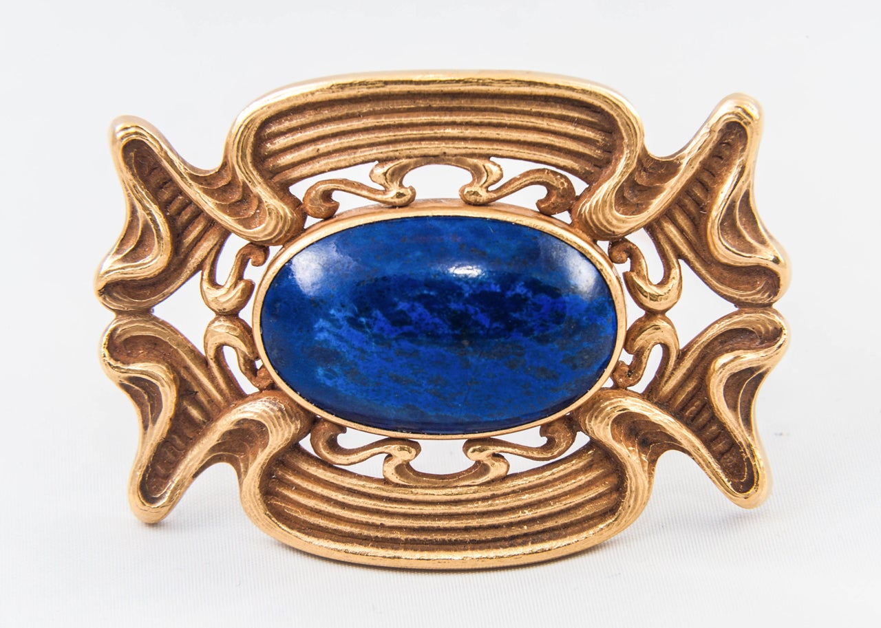 Art Nouveau Gold Brooch set with cabouchon Sodalite. The Gold tested as 18ct. The reverse has a pin fitting with safety catch.