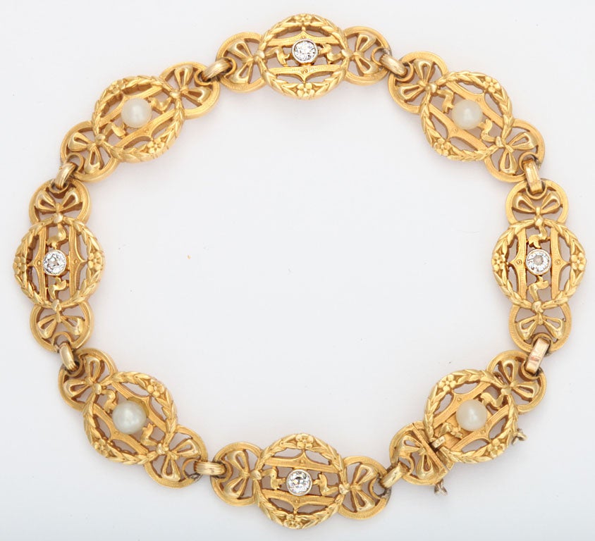 Antique French heavily chased Bracelet with alternating bezel set Diamond & alternating  Natural Pearl. Engraved on both sides.  Edwardian Period. Has French touch marks of the period with traces of a retailer's mark.  7 3/4