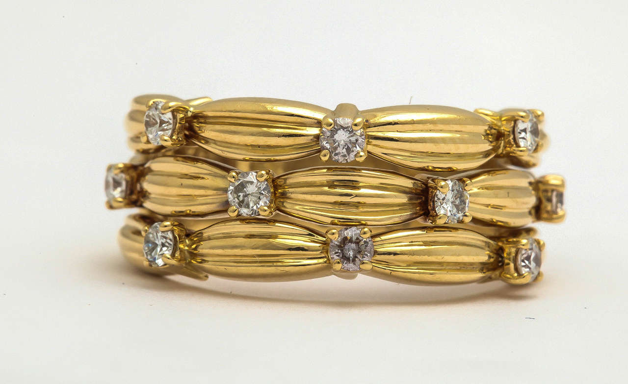 18 KT Textured Yellow Gold 3 Row Band Ring Consisting of 10 Very High Quality Full Cut Diamonds
Signed Tiffany & Co.
Dated 1992 
Ring Size 7 Can be sized to any size required