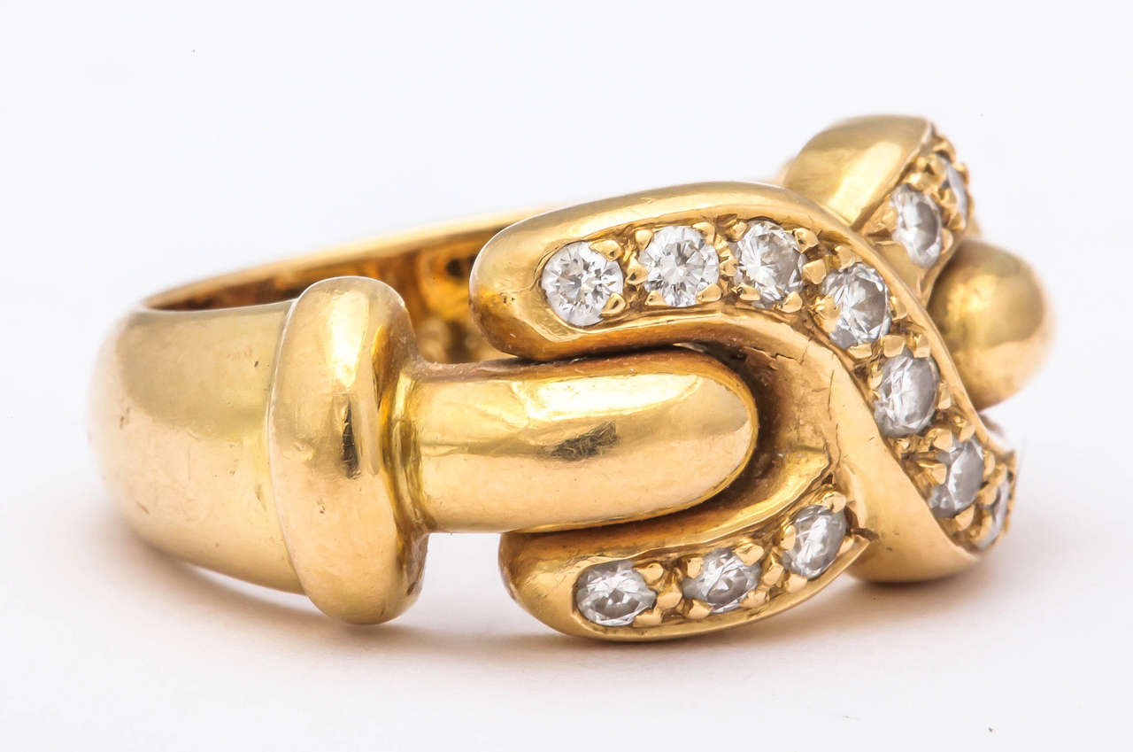A chic French 18k gold and diamond ring in the form of an X or 