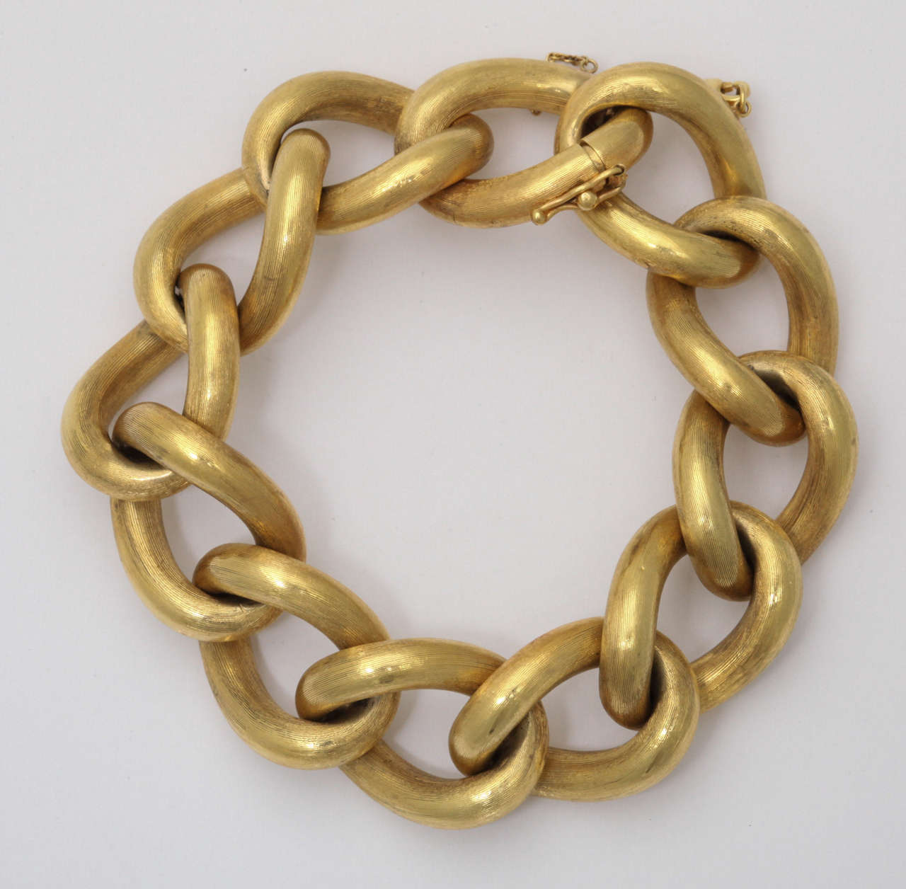 14kt Yellow Gold Bracelet with hollow links.  Florentine finish.  With a hinged closing.  So sixties.  Very chichi & wearable.  The perfect addition.