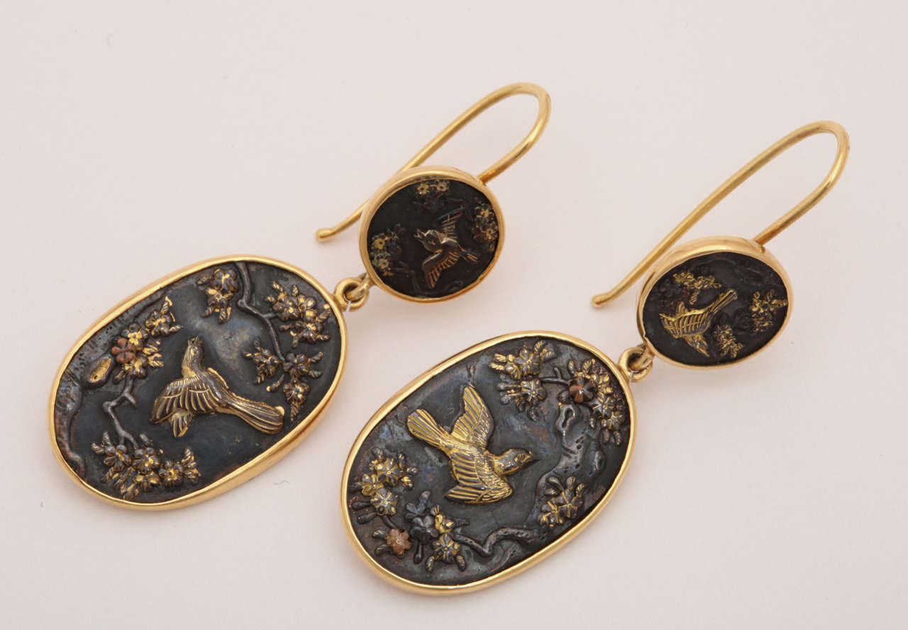 A pair of 19th century Shakudo earrings that resemble gold framed Japanese miniature paintings. The discovery of Japanese Art  was represented in Victorian Jewelry beginning in 1870. Both the Japanese and British were enwrapped in the magic of the