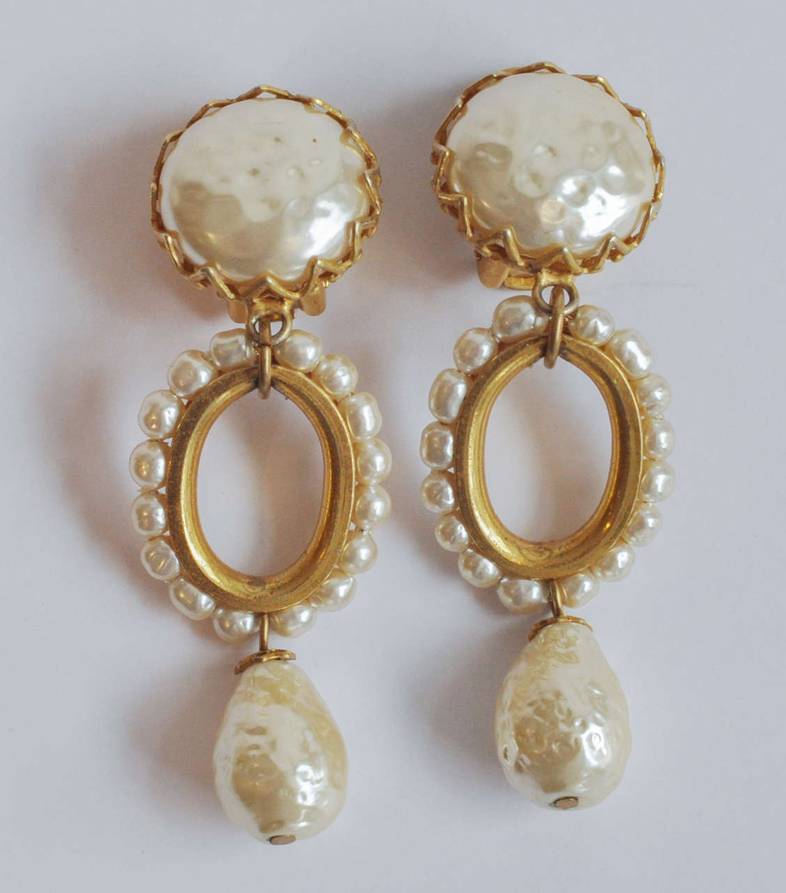 A classic and elegant pair of Miriam Haskell pearl earrings with an interesting oval design.
Clip backs. Signed.