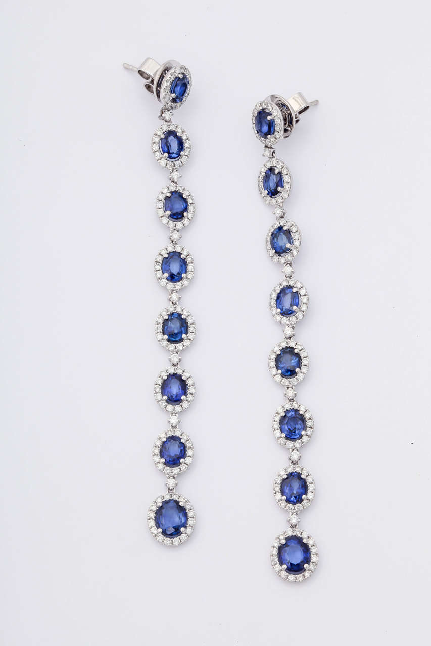 This absolutely stunning sapphire and diamond earrings, features 25 carats of royal blue sapphires and 4.50 carats of diamonds. Set in 18KT white gold. 
2 inches long