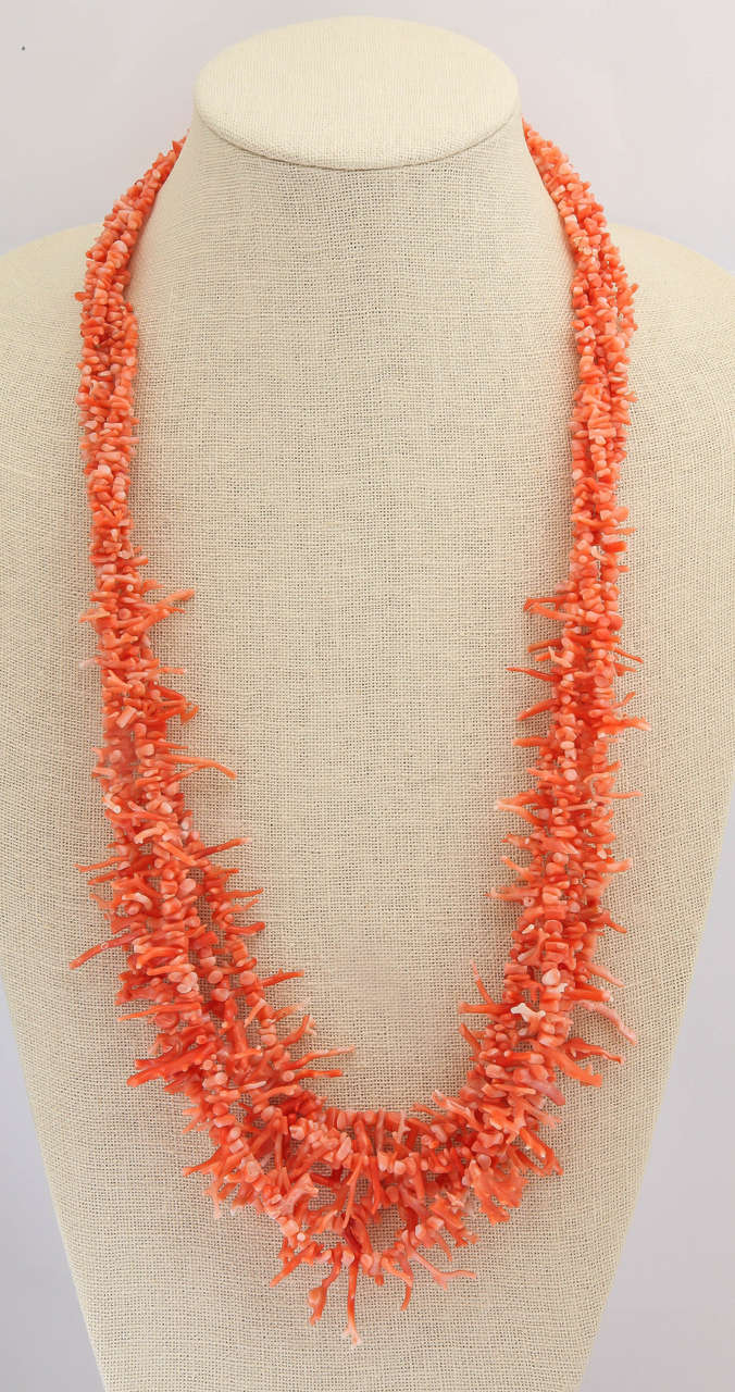 There are 5 strands of delicious orange natural color coral. The coral graduates in size from 1/4 in. near the clasp to 1- 1 1/4 in the center of the necklace. The most elegant  and classical necklace for  summer outings. This elegant multistrand