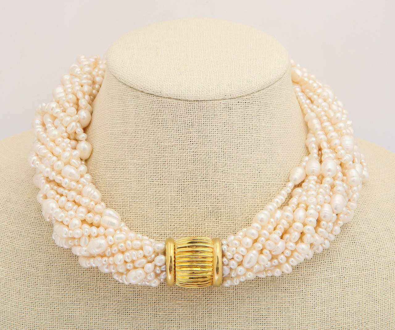 This lush necklace has 16 strands of multi-shape fresh water pearls to achieve a wonderful texture to compliment any ensemble. The vermeil clasp is magnetic and strong and secure. The total length of the necklace is 18-19 in. depending on the twist.
