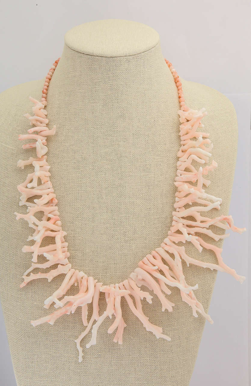 One of mother natures finest creations. This branch coral necklace is about 25 in. long. The long branches average from 2.5 to 3 in. The wonderful soft light orange angel skin is complimentary to any complexion and any ensemble. The necklace is