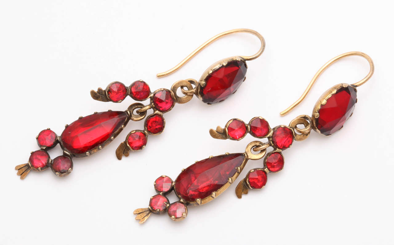 You feel excitement being close to the fiery red- orange shine of these 18kt Georgian Perpignan Garnet Earrings , Known as Le Grenat de Perpignan these stones were mined in North Catalan in 1750 but are no longer. The excellent unique cut of the